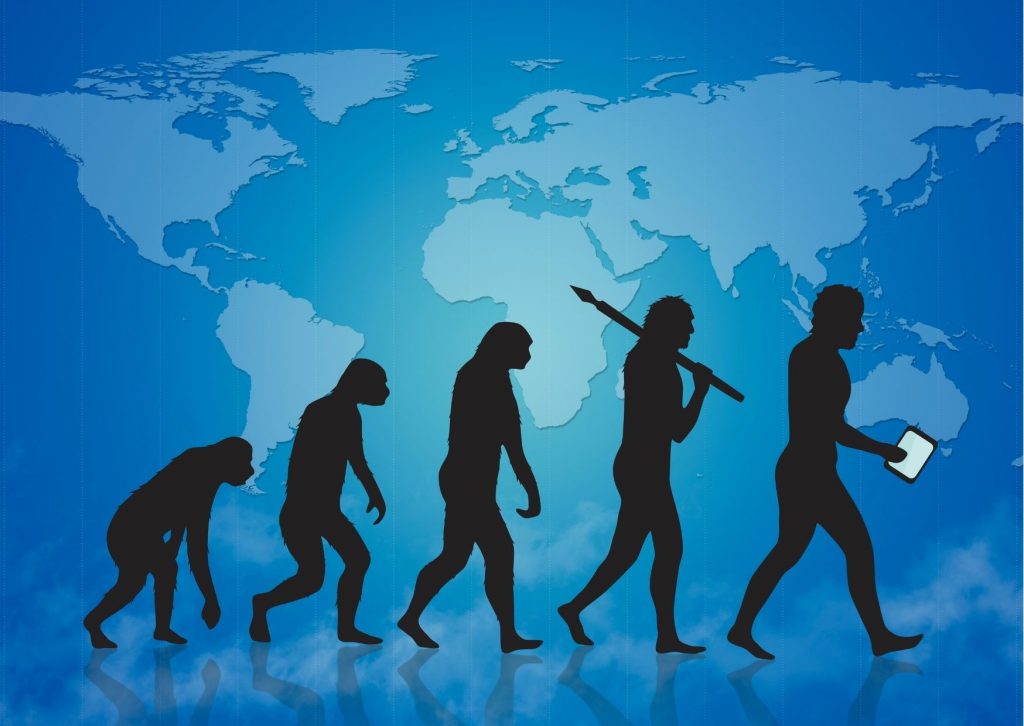 Ilustración que muestra la evolución del hombre en siluetas que van sobre el fondo de un mapa del mundo en azul. Tema: a qué edad salen las muelas del juicio.
